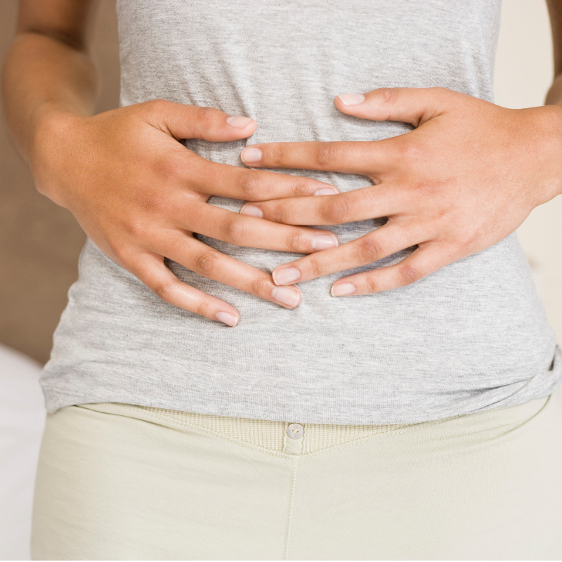 Woman holding stomach